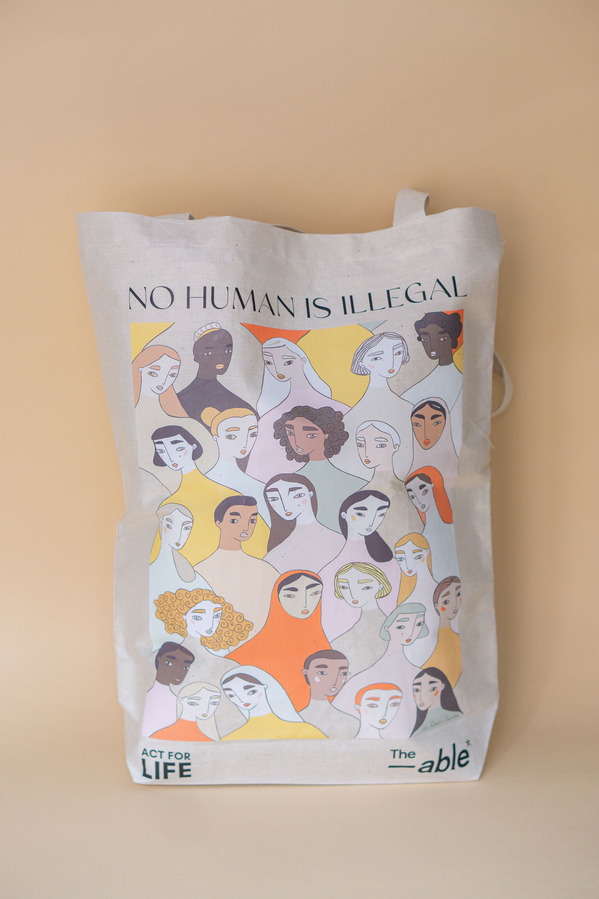 "No human is illegal" tote bag
